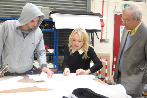 Julia Cambridge visiting a Chesterfield medical supply factory and talking to a former apprentice now in full employment where he trained.