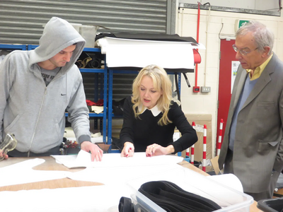 Julia Cambridge visiting a Chesterfield medical supply factory and talking to a former apprentice now in full employment where he trained.