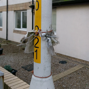 Old planning notices on lamp post / street light