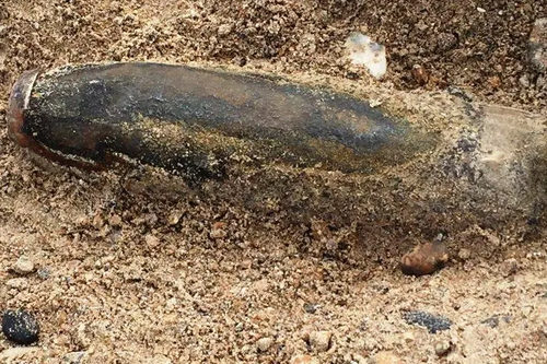 Unexploded WW2 shell (UXB) on beach