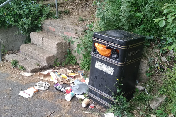 Overflowing waste bin