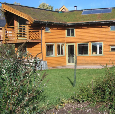 John Willoner's Eco-House at Findhorn. Turf roof, passive solar, solar panel.