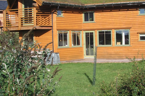 John Willoner's Eco-House at Findhorn. Turf roof, passive solar, solar panel.