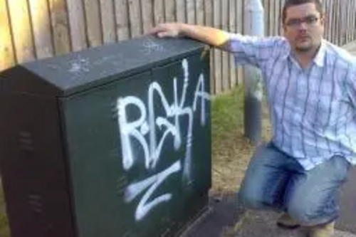 Tim Prater by graffiti on cable phone junction box