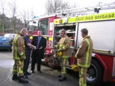 Peter Carroll talking with local firefighters