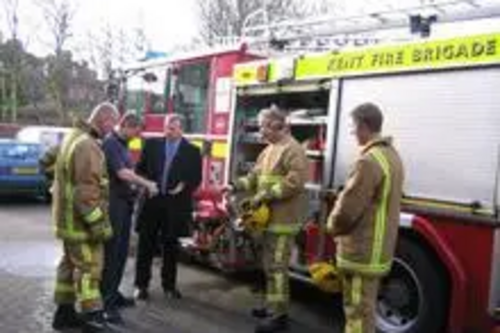 Peter Carroll talking with local firefighters