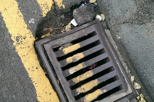 Street drain / double yellow lines / potholes