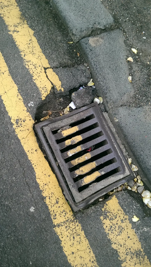 Street drain / double yellow lines / potholes