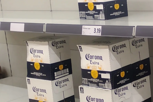 Corona beer in boxes on shelves