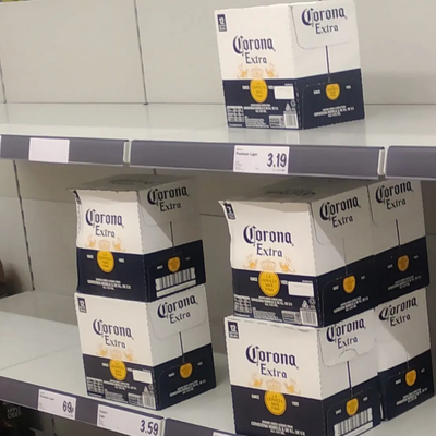 Corona beer in boxes on shelves