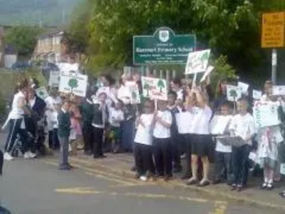 Pupils and parents demonstrate against the closure of Harcourt School