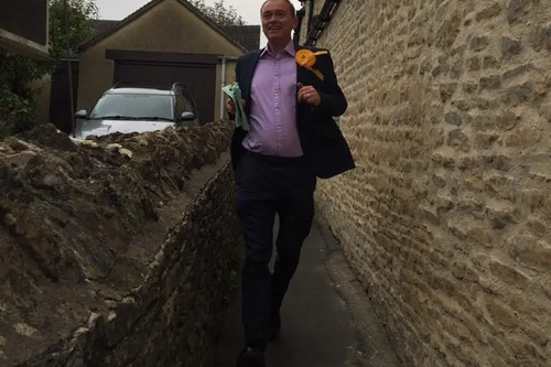 Tim Farron campaigning / running