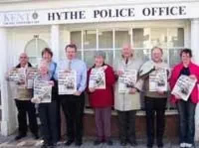 Hythe Lib Dems holding up posters calling for more police now