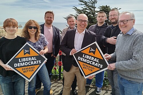 Larry Ngan and Lib Dem Campaigners on The Leas, Folkestone with posters