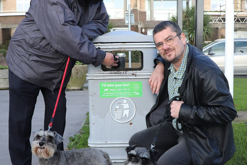 David Monk and Tim Prater with "I'll Take Poo Too" sticker on bin