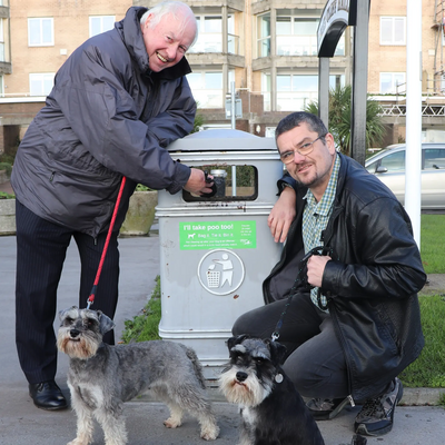 David Monk and Tim Prater with "I'll Take Poo Too" sticker on bin