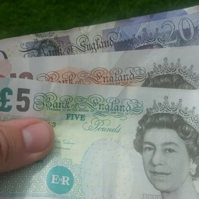 Money / banknotes (pounds sterling) in hand