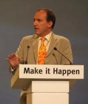 Simon Hughes MP at conference podium