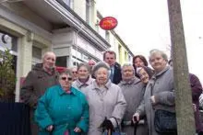 Peter Carroll with local residents outside Warren Road's Post Office during the campaign to save it