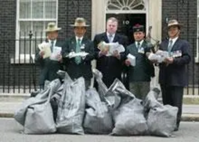 Peter Carroll handing petitions in to 10 Downing Street with retired Gurkhas