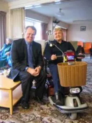 Peter with a resident of Walmsley House and her buggy