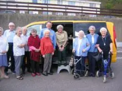 Claire Rayner and Peter Carroll with some of the residents of Holywell House