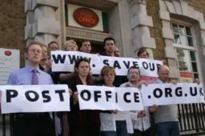 Shepway Lib Dems outside Folkestone Post Office with www.saveourpostoffice.org.uk banner