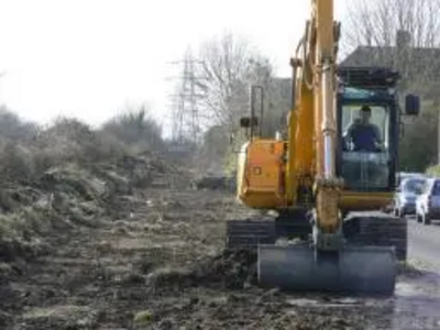 Digger / bulldozer clearing site