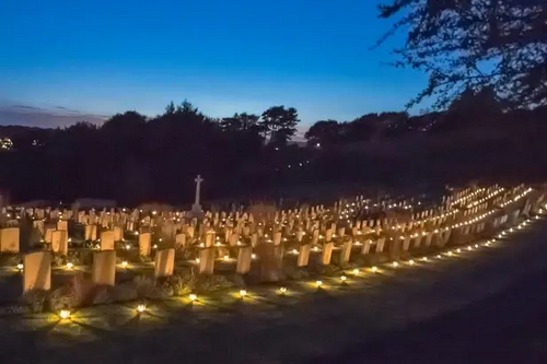 Shorncliffe Military Cemetery lit by lanterns